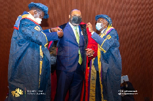 The Minister for Energy, Dr Matthew Opoku Prempeh (middle) being conferred with a doctorate at UPSA