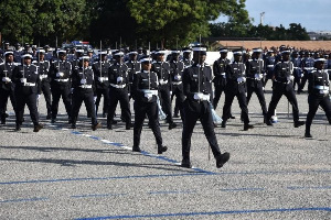 Police oficers march during a parade