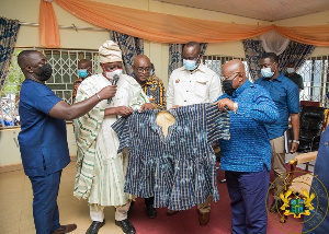 Akufo-Addo in blue taking batakari