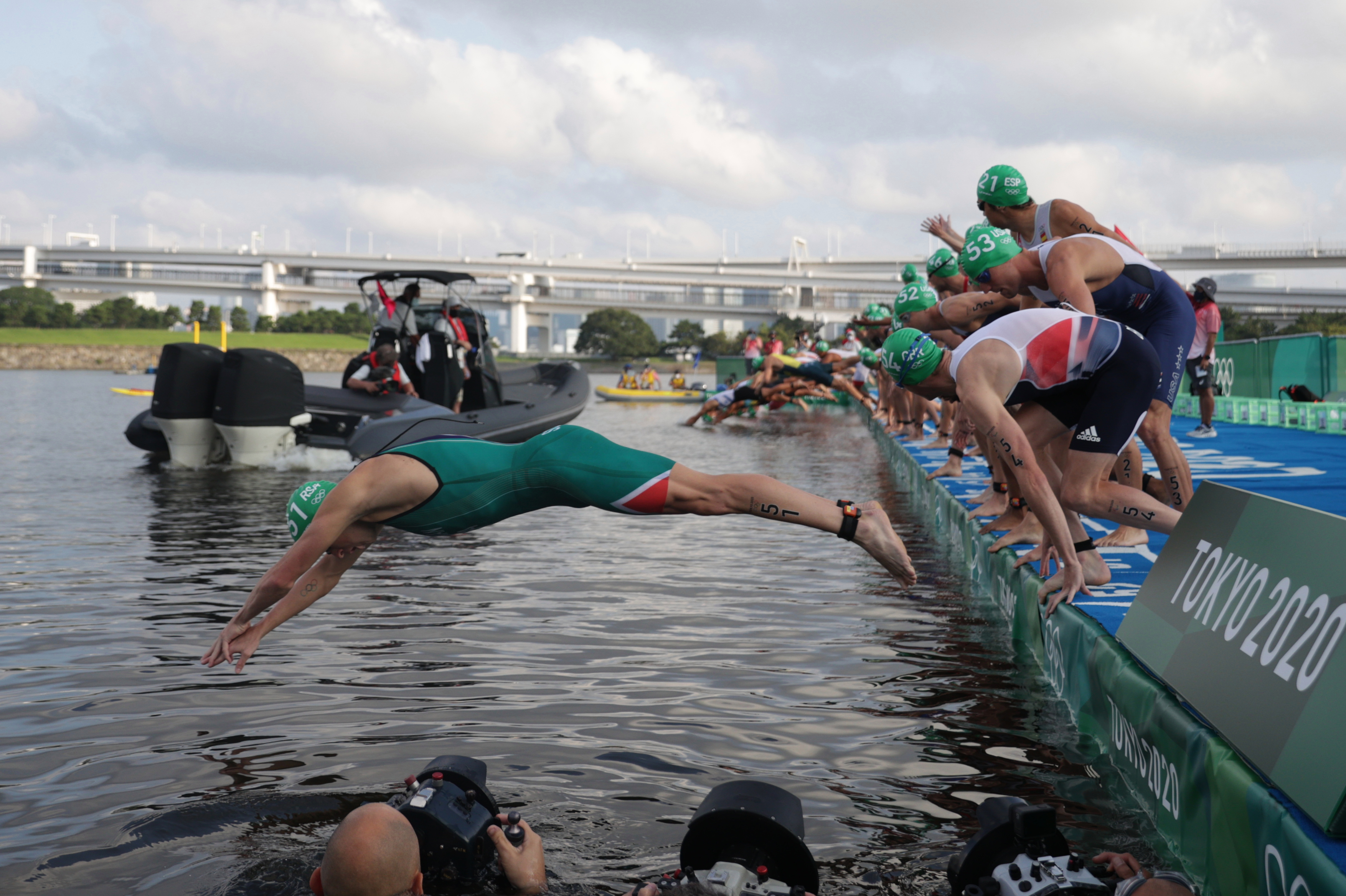 A boat was in the way of athletes as they dived into the water in shocking scenes