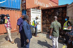 Benito Owusu-Bio and some officials inspecting one of the containers