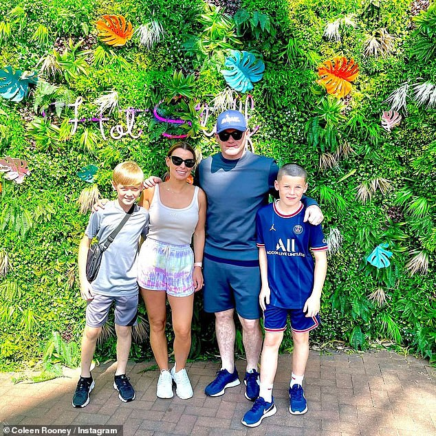 Theme park day out: Coleen Rooney looked glowing alongside husband Wayne as they enjoyed a fun day out at Thorpe Park on Wednesday