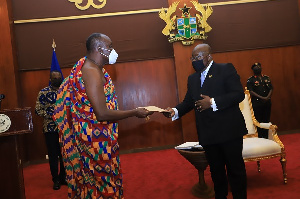 President Akufo-Addo receives the report from chair of the Council of State