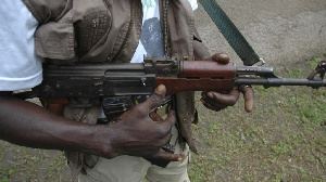 A file photo of a man holding a gun