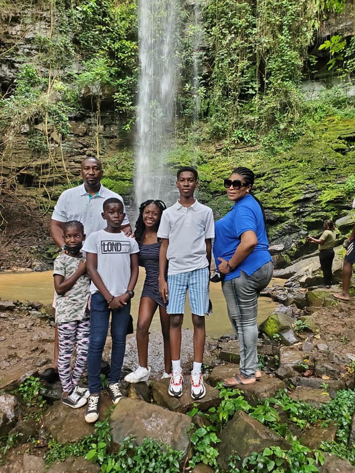 May be an image of 6 people, people standing and waterfall