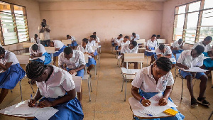 Students writing exams in a hall