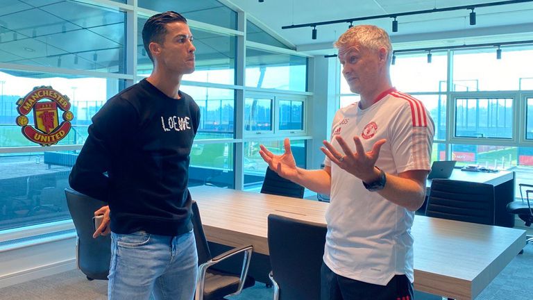 Cristiano Ronaldo speaks to manager Ole Gunnar Solskjaer on his return to Manchester United