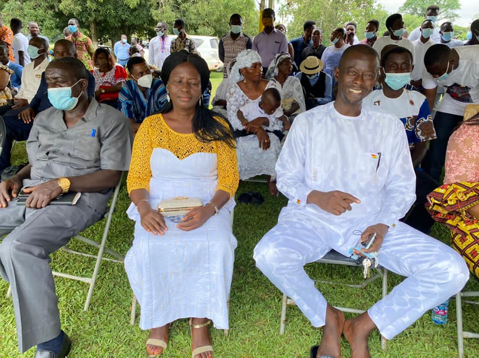 May be an image of 5 people, people sitting, people standing and grass