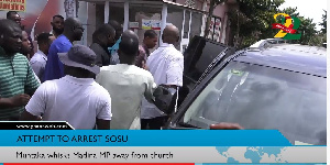 Lawyer Sosu being led to Mr Muntaka's car