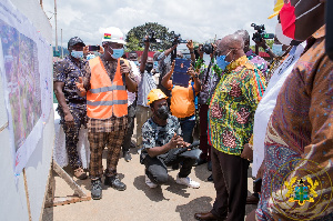 President Akufo-Addo listens to a road contractor during his Eastern Regional tour