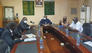 Christian Nti (second from left) briefing Professor Amin Alhassan (middle) and other directors