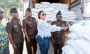 Minister for Fisheries and Aqua-culture development, Hawa Koomson, presenting items