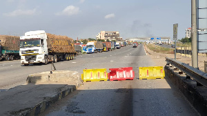 Articulator trucks parked around the Motorway tollbooth