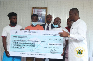 Sports Minister presenting the cheque