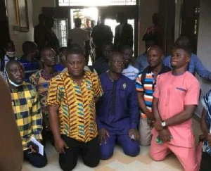 The Assembly members kneeling before the Juabenhene