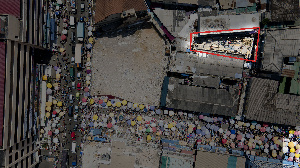 The three-storey building is being erected in a small space meant to be a compound