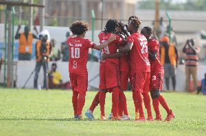 Asante Kotoko players celebrating with the Isaac Oppong