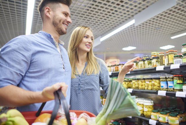 Couple shopping in grocery store.