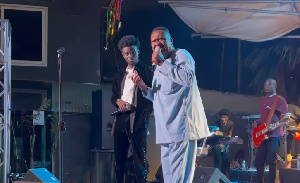 A. B. Crentstil performs with Kuami Eugene on