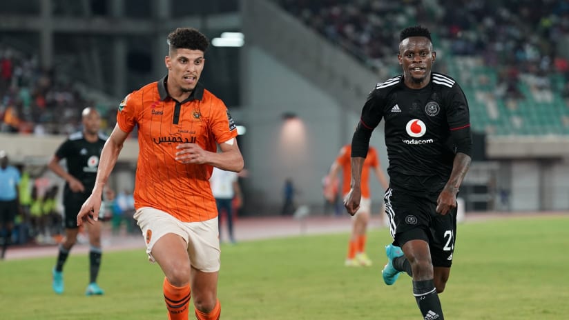 Youssef Elfahli of RS Berkane and Innocent Maela of Orlando Pirates challenge for possession during the CAF Confederation Cup 202122 Final between Orlando Pirates and RS Berkane held at the Godswill Akpabio Inter