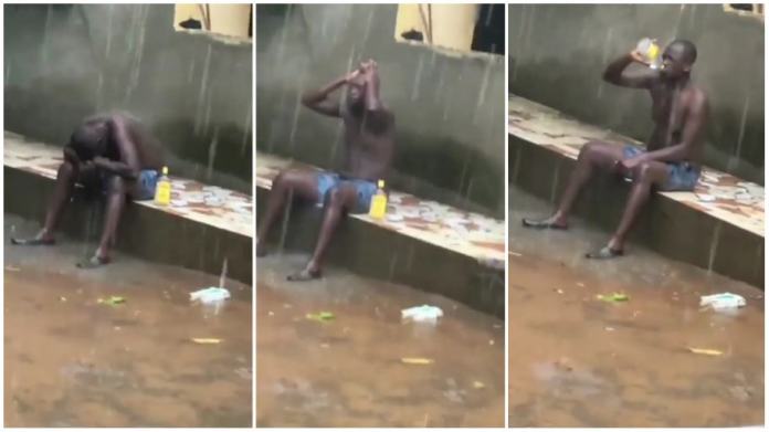 broken-hearted man sitting in a rain 