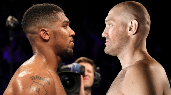 MANCHESTER, ENGLAND - DECEMBER 10: Wladimir Klitschko of Ukraine looks at Anthony Joshua of England (L) following the announcement that the pair will fight at Wembley Stadium in April 2017, at Manchester Arena on December 10, 2016 in Manchester, England. (Photo by Richard Heathcote/Getty Images)