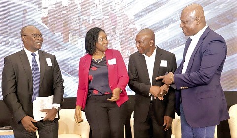 Ato Afful (right), Managing Director, GCGL, in a handshake with Prof. Godfred Bokpin (2nd from right), an economist. With them are Dr Priscilla Twumasi Baffour (3rd from right), Senior Lecturer, Department of Economics, University of Ghana, and Dr Valentin Mensah (left), Governance Researcher. Picture: SAMUEL TEI ADANO