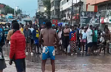 Angry residents of Dome Parakou block main road after downpour