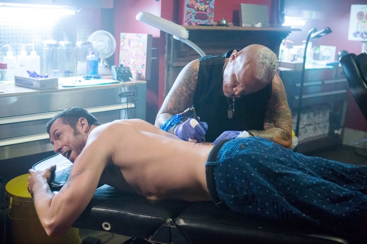 Adam Sandler getting a tattoo on his back by Timothy Douglas Perez in "The Do-Over"