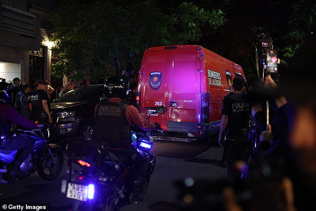 A firefighter ambulance departs the Casa Sur Hotel in Buenos Aires with Payne's body