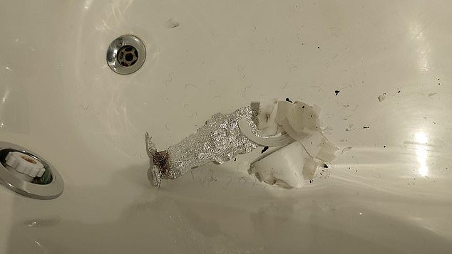 A burnt candle and more aluminium foil were found in a bath tub in the suite