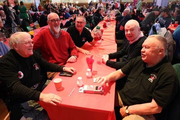 Group of people sat at table